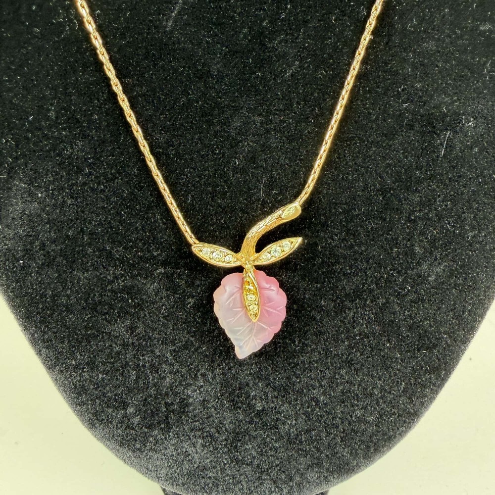 Christian Dior vintage featuring a signature pink leaf design.